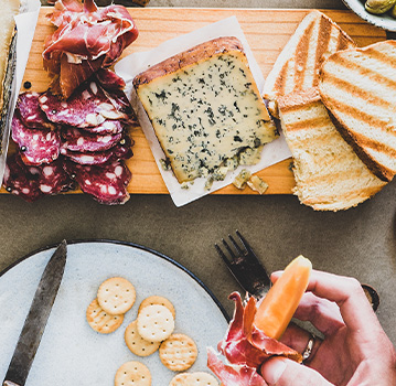 Charcuterie board with meat and cheese